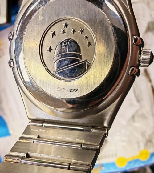location of serial number and caliber number on an omega watch case back